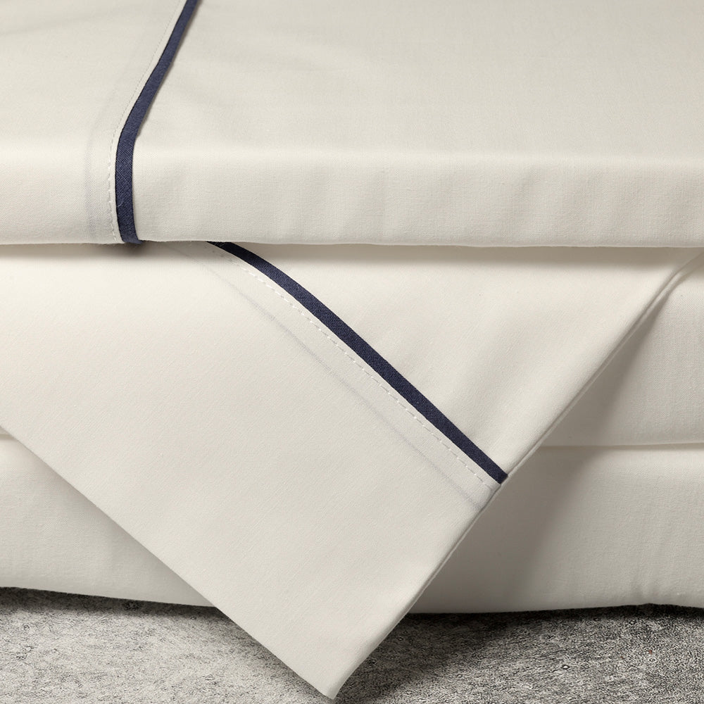 white and navy bed sheets
