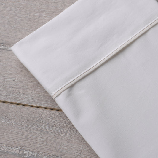 white tan bed sheets